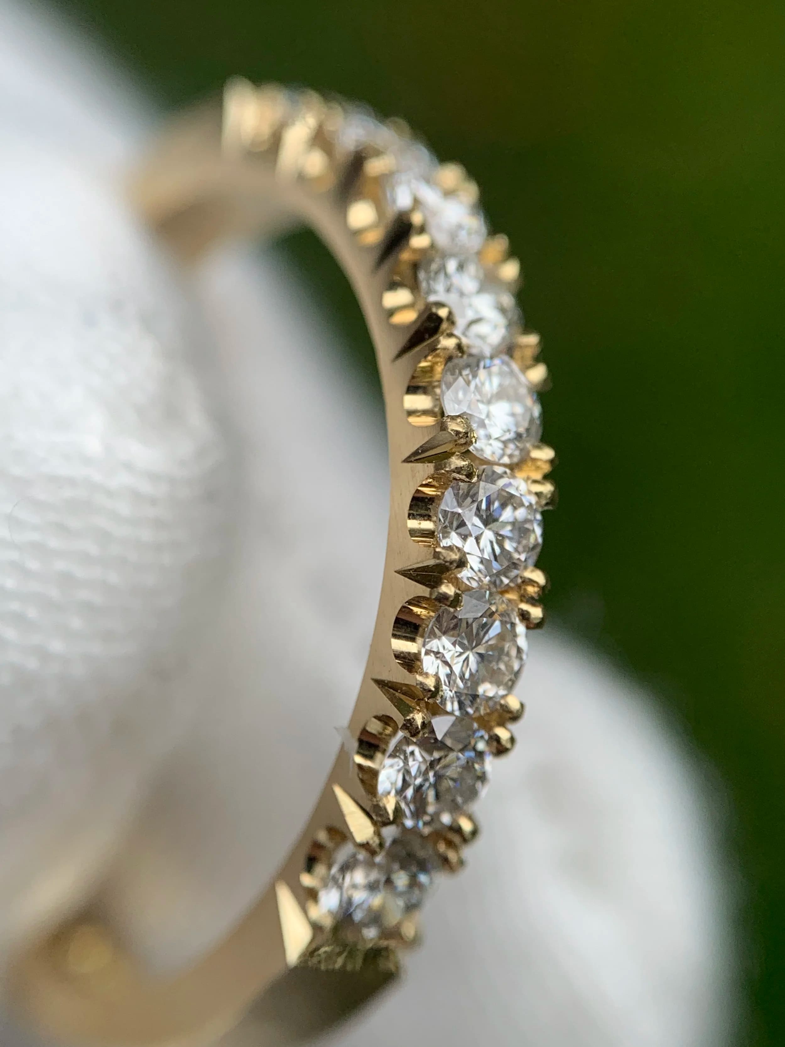 Close-up jewellery setting work at the Atelier Barnard bench.