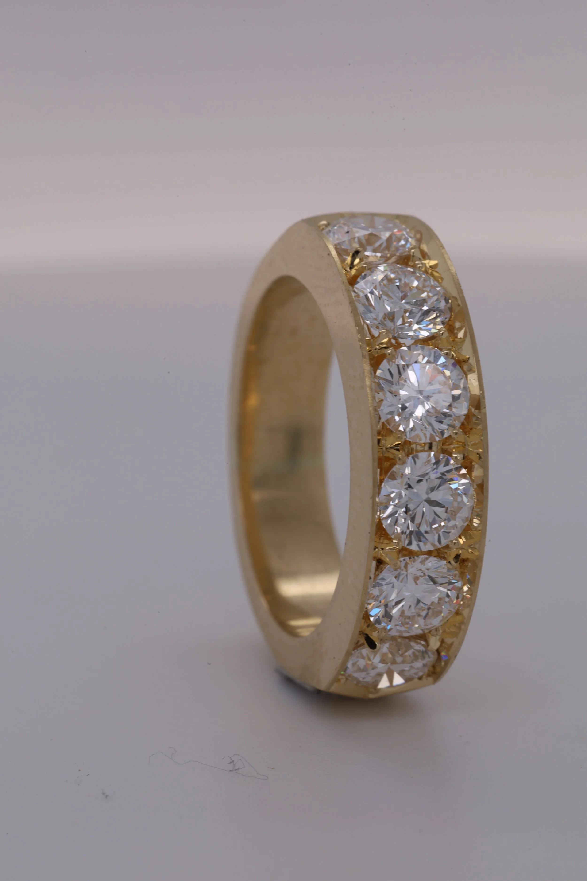 Vertical close-up of fine jewellery work by Atelier Barnard.