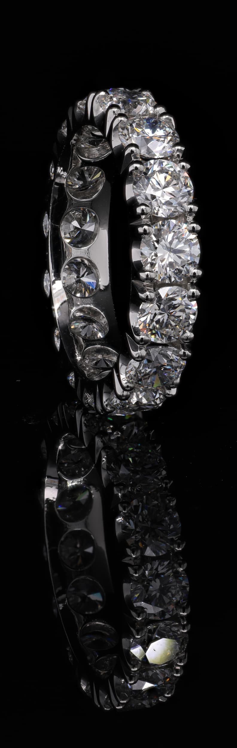 Tall diamond-set ring photographed from the front.